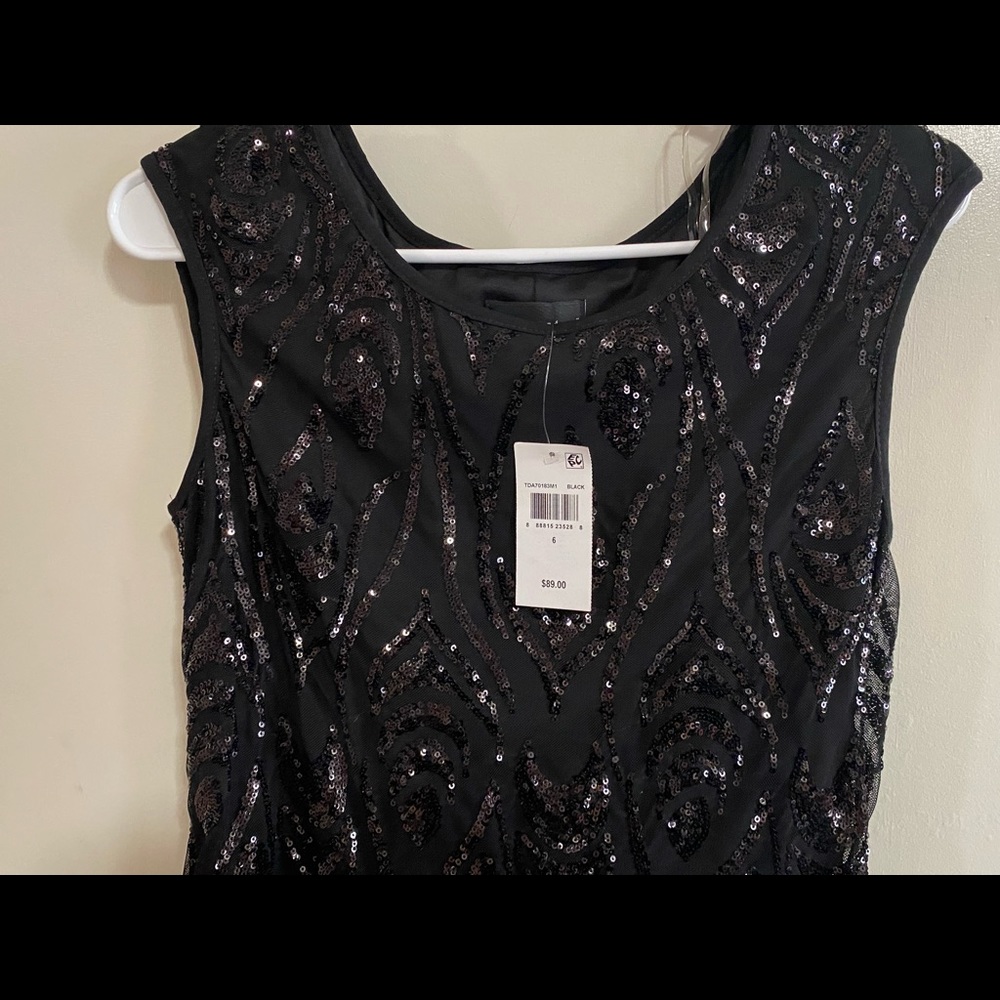 completely new black dress I bought it at macys in the wrong size